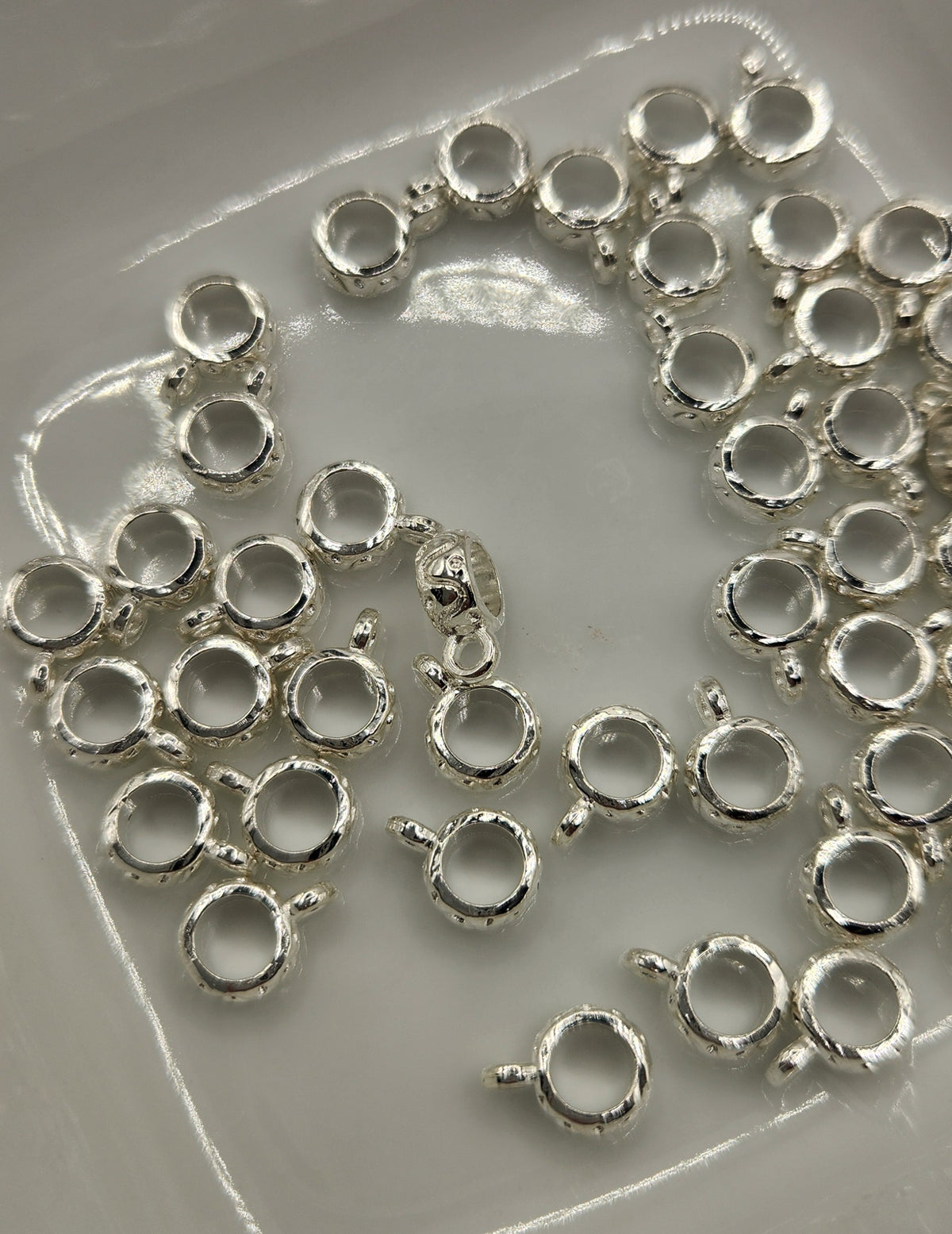 Bail spacers with charm *Individually sold